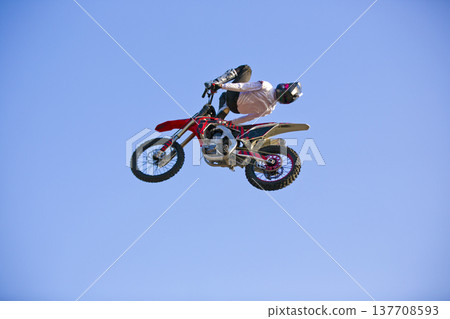 Motorcycle rider performing dangerous midair stunt trick in Almaty Motorcycle rider performing dangerous midair stunt trick in Almaty 137708593