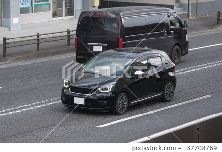 Compact car driving on the road Compact car driving on the road 137708769
