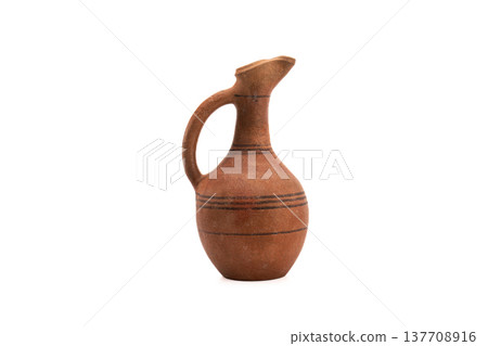 Terracotta jug with elegant curve and rustic texture Terracotta jug with elegant curve and rustic texture 137708916
