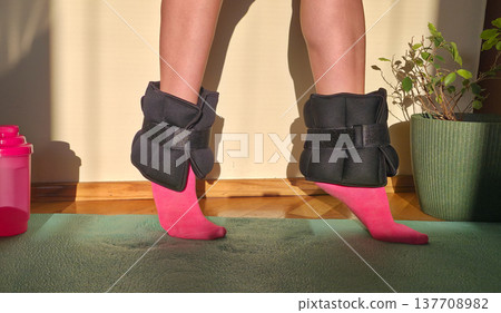 Foot and forearm weights for sports. Exercise weights. Sports accessories. Healthy lifestyle. High quality photo Foot and forearm weights for sports. Exercise weights. Sports accessories. Healthy lifestyle. High quality photo 137708982