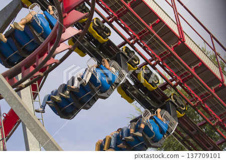 People Riding Roller Coaster Seats Enjoying Thrilling Amusement Park Adventure People Riding Roller Coaster Seats Enjoying Thrilling Amusement Park Adventure 137709101