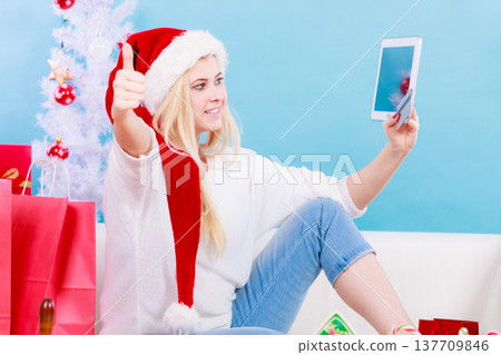 Girl with tablet credit card doing online shopping 137709846