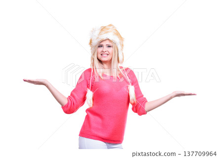 Attractive woman wearing furry winter hat Attractive woman wearing furry winter hat 137709964