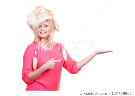 Attractive woman wearing furry winter hat Attractive woman wearing furry winter hat 137709965