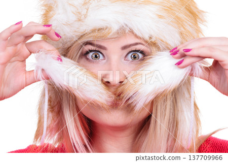 Attractive woman wearing furry winter hat 137709966