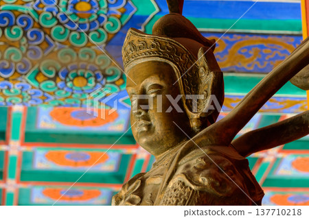Asian Guardian Statue Under Colorful Temple Ceiling 137710218