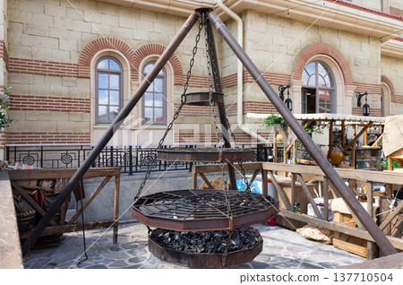 A large metal structure with a grill on top. 137710504