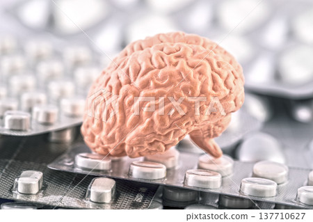Human brain on heap of many various pills and tablets packs 137710627