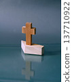 Simple wooden cross on a stand 137710922