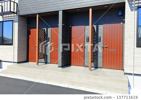 Image of the entrance of an apartment, condominium, multi-unit housing, or house. Image of the entrance of an apartment, condominium, multi-unit housing, or house. 137711619