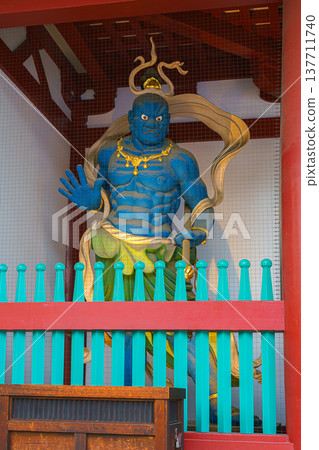 Osaka, Japan - Sep 21 2024, vertical, close up view of blue Nio Guardian statue at entrance of Shitennoji Temple, at daytime, without people, Osaka, Japan 137711740