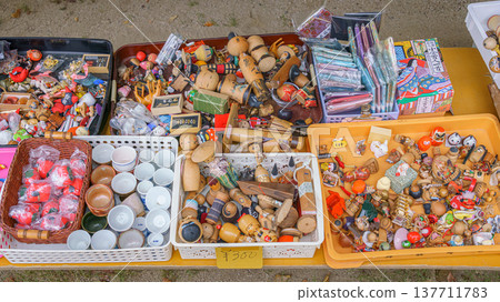 Osaka, Japan - Sep 21 2024, Close-up view of a counter with various antique toys and household items related to Japanese culture at flea market on territory of the Shitenno-ji Temple Osaka, Japan  137711783