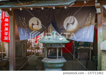 Osaka, Japan - Sep 21 2024, close-up view of the altar with a lantern or an incense candlestick, on the territory of the Shitenno-ji buddhist temple, at daytime, without people, Osaka, Japan 137711862