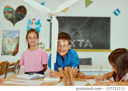 Children in a classroom building a small wind turbine for a hands-on science and STEM learning project Children in a classroom building a small wind turbine for a hands-on science and STEM learning project 137712113