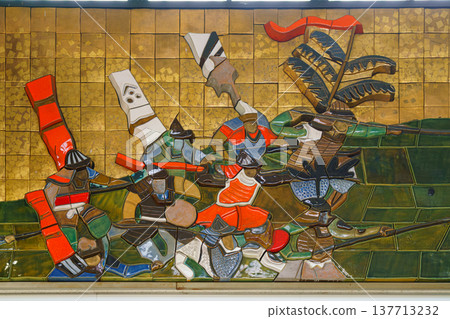 Osaka, Japan - Sep 22 2024, Close-up view of a ceramic mosaic drawing depicting the life of the ancient Japanese, in the entrance of JR Osaka castle station, Osaka, Japan Osaka, Japan - Sep 22 2024, Close-up view of a ceramic mosaic drawing depicting the life of the ancient Japanese, in the entrance of JR Osaka castle station, Osaka, Japan 137713232