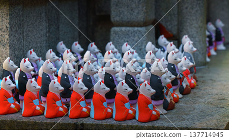 Kyoto, Japan - Sep 23 2024, A close-up view of the many small figures of white kitsune foxes dressed in traditional Japanese costumes at the Fushimi Inari Temple, at daytime, Kyoto, Japan Kyoto, Japan - Sep 23 2024, A close-up view of the many small figures of white kitsune foxes dressed in traditional Japanese costumes at the Fushimi Inari Temple, at daytime, Kyoto, Japan 137714945
