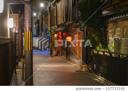 Kyoto, Japan - Sep 23 2024, Panoramic view of a quiet narrow street in Gion tea house district, Geisha street, without people, at night with street light, Kyoto, Japan 137715192