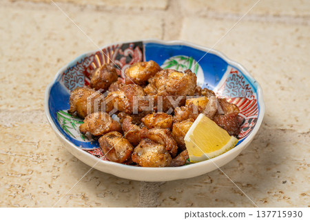 Grilled chicken cartilage with charcoal - a dish featuring grilled chicken cartilage with a crunchy texture. 137715930