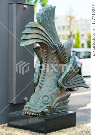 Himeji, Japan - Sep 24 2024, vertical, close up view of giant sculpture of Shachihoko, a creature from Japanese folklore which decorate a roof ridge, standing on street, without people, Himeji, Japan Himeji, Japan - Sep 24 2024, vertical, close up view of giant sculpture of Shachihoko, a creature from Japanese folklore which decorate a roof ridge, standing on street, without people, Himeji, Japan 137716077