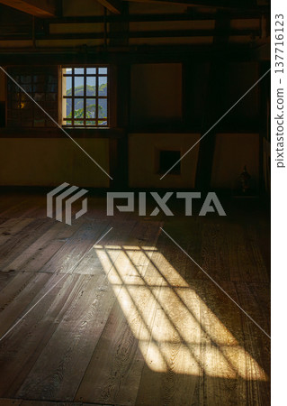 Himeji, Japan - Sep 24 2024, panoramic view of room with sunlight passes through window and leaves a beautiful lattice print on floor, inside Himeji Castle, White Heron castle, Himeji, Japan Himeji, Japan - Sep 24 2024, panoramic view of room with sunlight passes through window and leaves a beautiful lattice print on floor, inside Himeji Castle, White Heron castle, Himeji, Japan 137716123