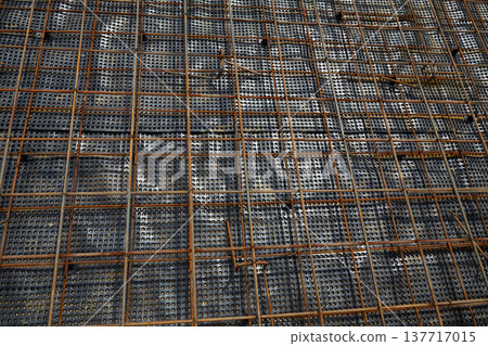 The construction of a concrete foundation using reinforcing steel prepared at the construction site The construction of a concrete foundation using reinforcing steel prepared at the construction site 137717015