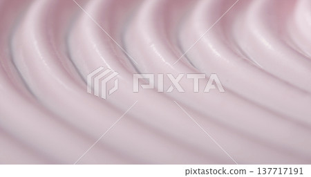 Close-up view of smooth pink substance layered in curved lines on a surface during daylight hours Close-up view of smooth pink substance layered in curved lines on a surface during daylight hours 137717191