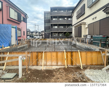 Foundation construction site for a detached house just before concrete is poured Foundation construction site for a detached house just before concrete is poured 137717364