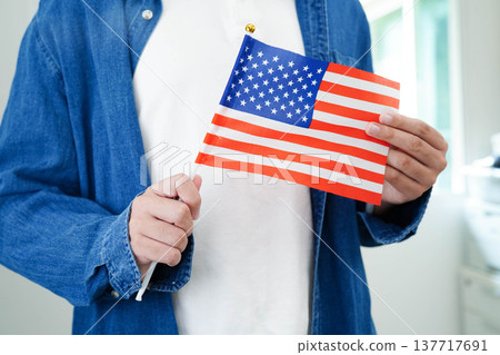 Learn English language, Asian teenage student hold book with flag in course at school. 137717691