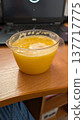 Fresh mango puree for work. Vibrant orange mango puree on desk 137717775