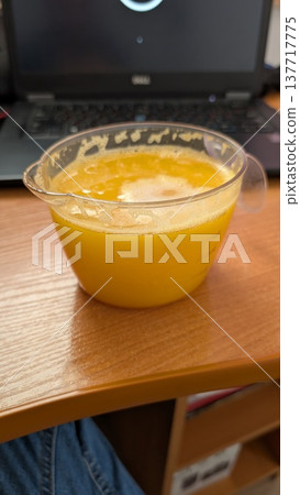 Fresh mango puree for work. Vibrant orange mango puree on desk Fresh mango puree for work. Vibrant orange mango puree on desk 137717775