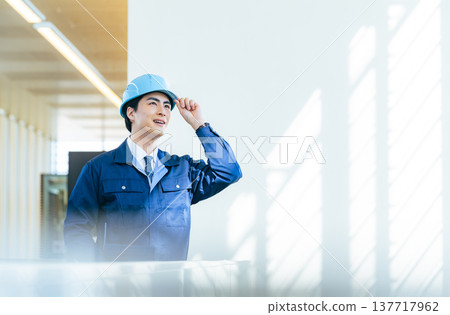 Male worker inspecting a building 137717962