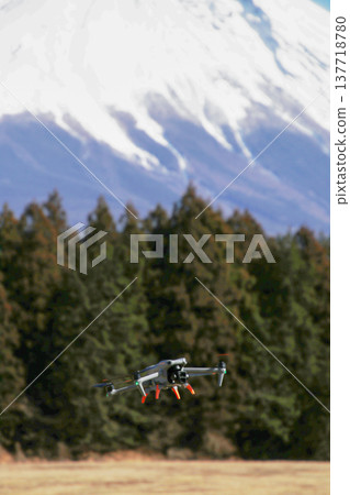 Drone aircraft flying over a grassland Drone aircraft flying over a grassland 137718780