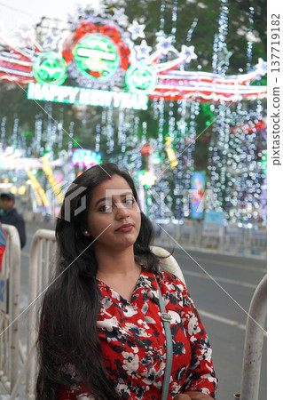 Beautiful Indian Woman Posing in Front of Happy New Year Street Decorations in Kolkata Beautiful Indian Woman Posing in Front of Happy New Year Street Decorations in Kolkata 137719182