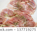 Pre-cooked chicken thighs seasoned with marinade 137719275