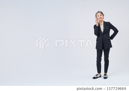 Senior woman talking on smartphone 137719669