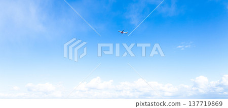 An image of an airplane taking off into the blue sky from an airport. An image of an airplane taking off into the blue sky from an airport. 137719869
