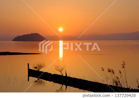 A sunset view of Lake Biwa and Chikubu Island. A sunset view of Lake Biwa and Chikubu Island. 137720420