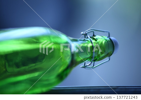 Empty Color Glass Bottle on the table Empty Color Glass Bottle on the table 137721243