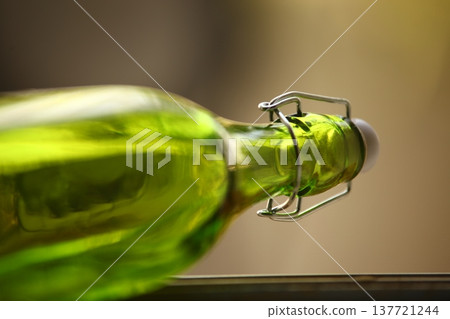Empty Color Glass Bottle on the table Empty Color Glass Bottle on the table 137721244