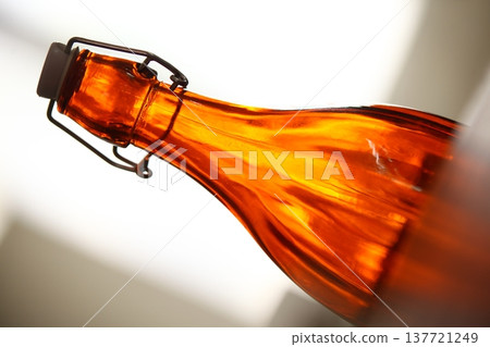 Empty Color Glass Bottle on the table Empty Color Glass Bottle on the table 137721249