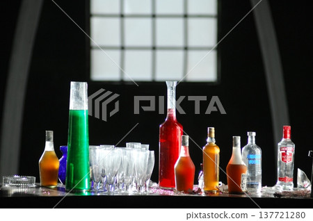 Empty Color Glass Bottle on the table Empty Color Glass Bottle on the table 137721280