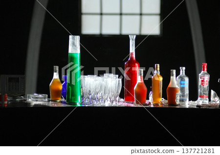 Empty Color Glass Bottle on the table Empty Color Glass Bottle on the table 137721281