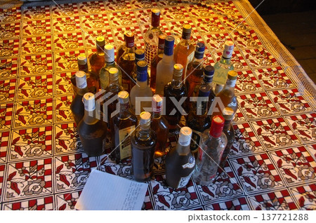 Empty Color Glass Bottle on the table Empty Color Glass Bottle on the table 137721288
