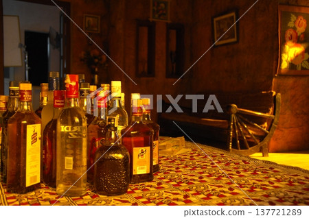 Empty Color Glass Bottle on the table 137721289