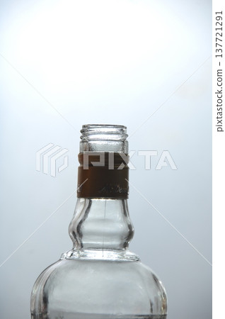 Empty Color Glass Bottle on the table Empty Color Glass Bottle on the table 137721291