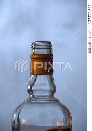 Empty Color Glass Bottle on the table 137721292