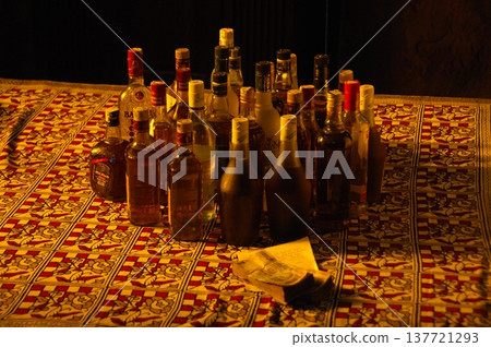 Empty Color Glass Bottle on the table Empty Color Glass Bottle on the table 137721293