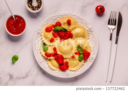 Ravioli with tomato sauce and basil Ravioli with tomato sauce and basil 137722462