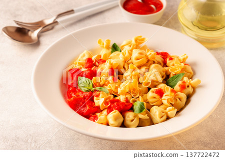 pasta in a plate with tomato sauce. pasta in a plate with tomato sauce. 137722472