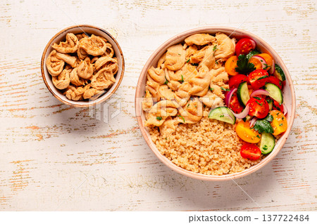 Bowl of quinoa with vegan soy meat and vegetables. Bowl of quinoa with vegan soy meat and vegetables. 137722484